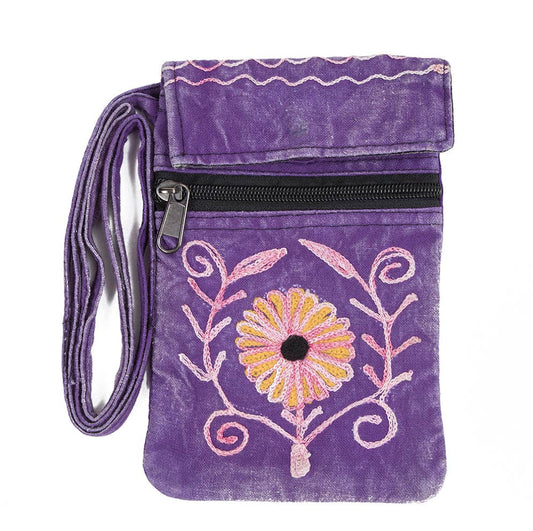 A purple velvet crossbody bag with a black zipper, featuring a colorful embroidered flower and vine design on the front pocket. The bag includes a matching purple fabric wrist strap with a silver metal buckle.