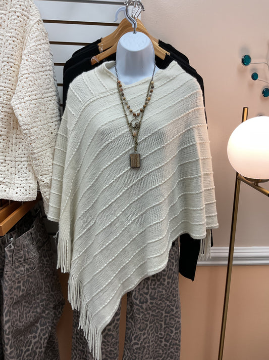 Sandy fringe poncho